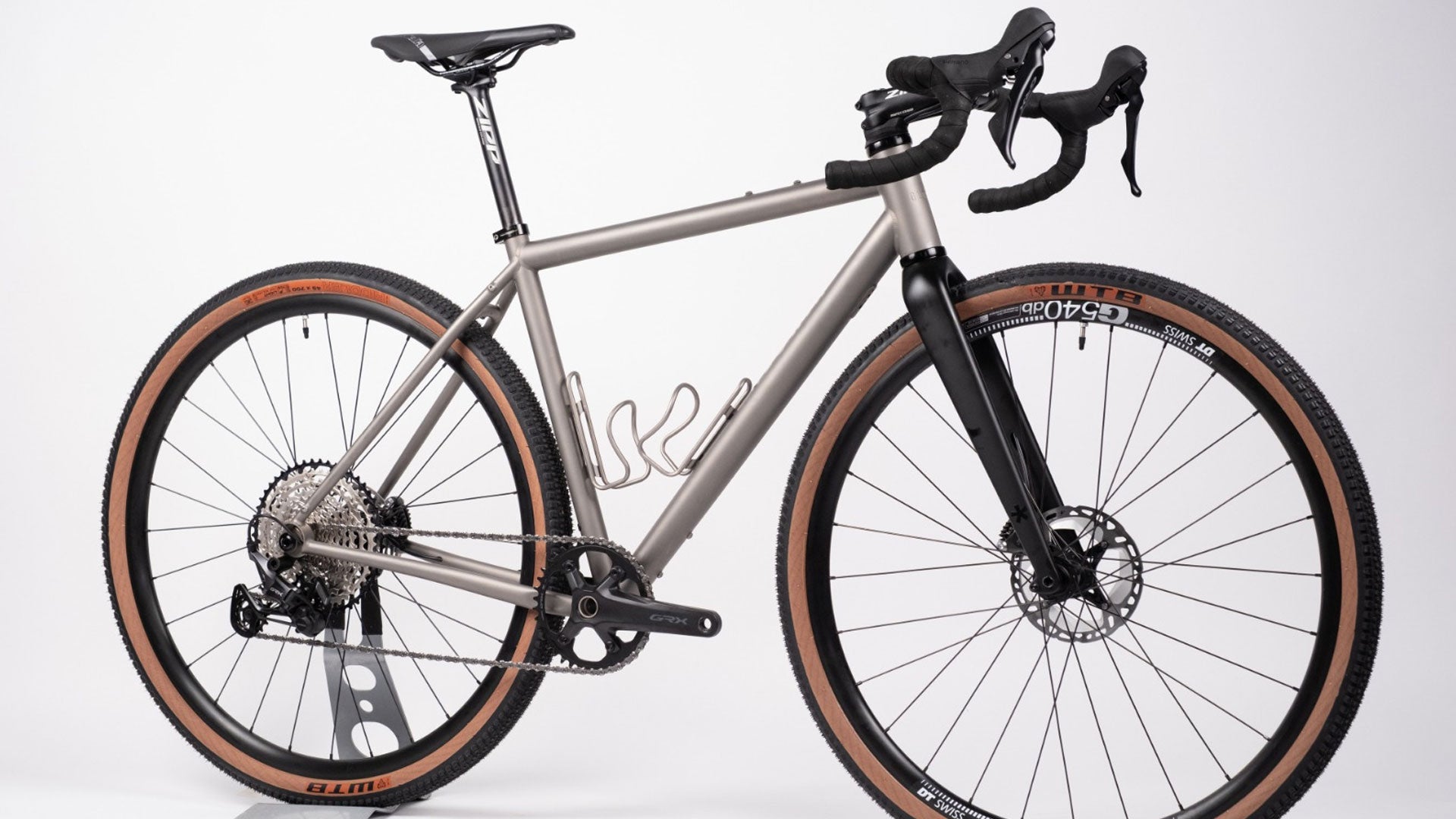 Silver bicycle with black components on a white background