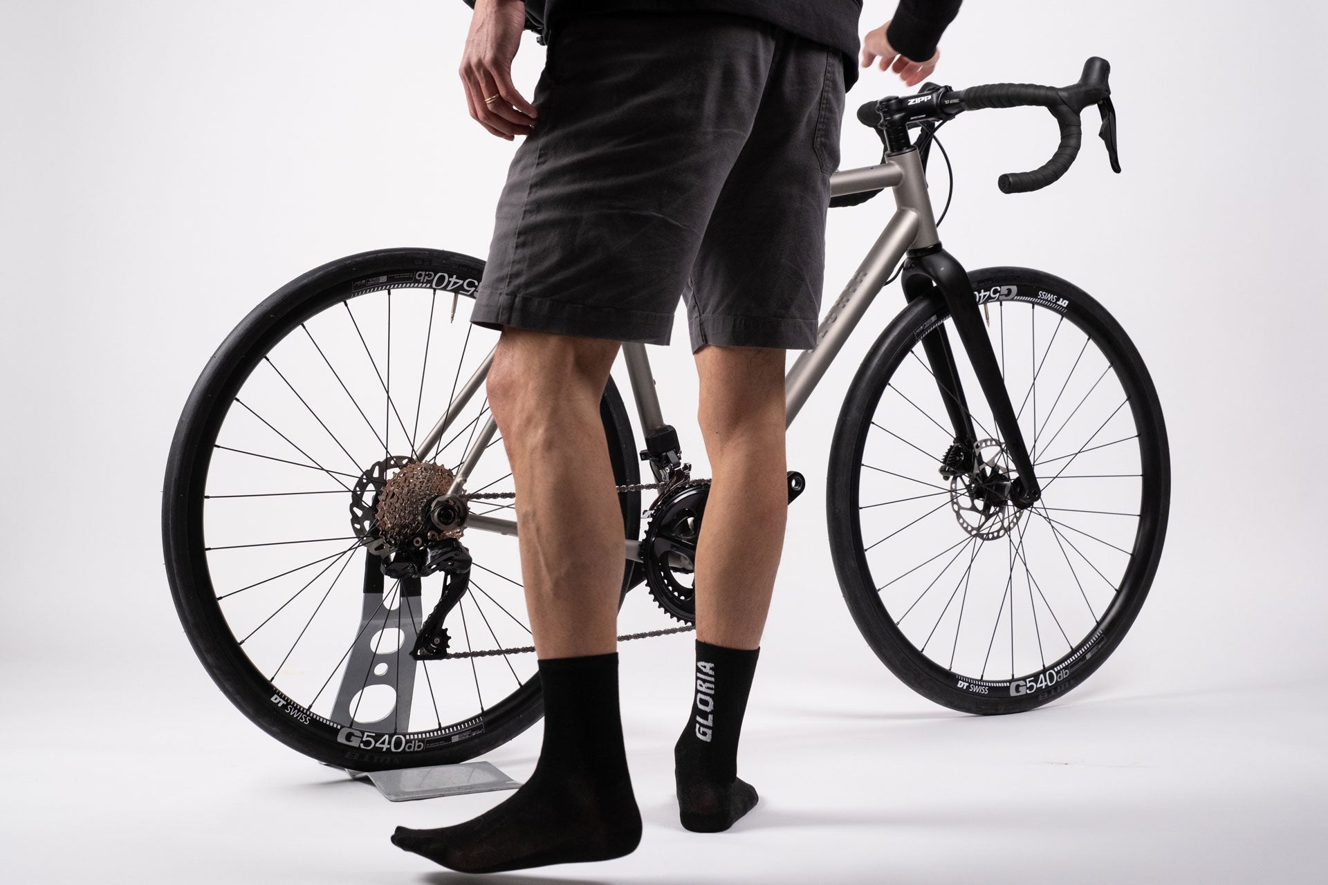 A Gloria Bike with a rider with gloria socks in front
