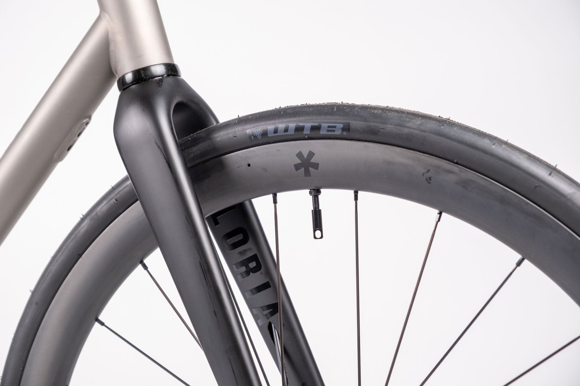 Close-up of a bicycle wheel with a white background