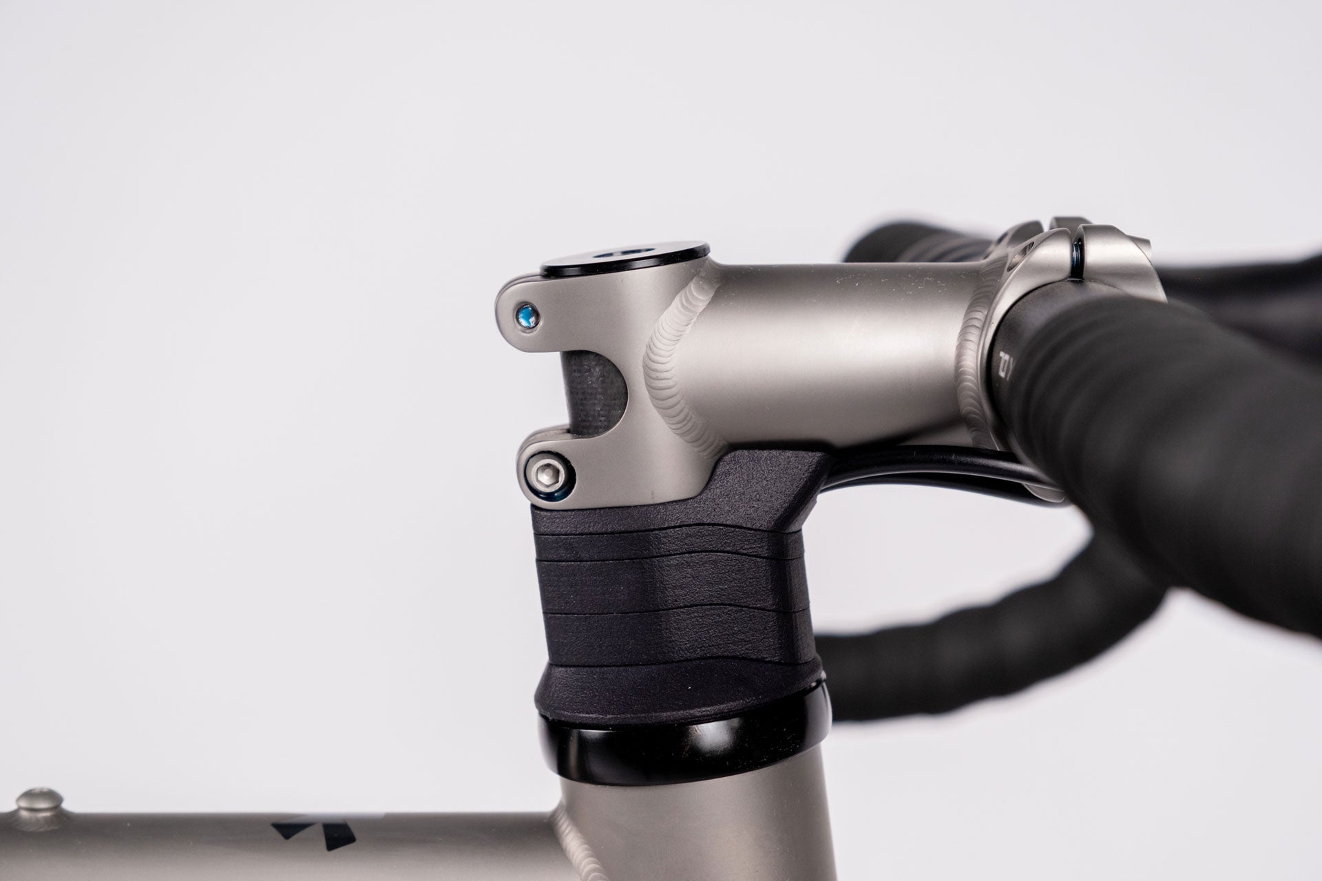 Close-up of a motorcycle handlebar with a white background