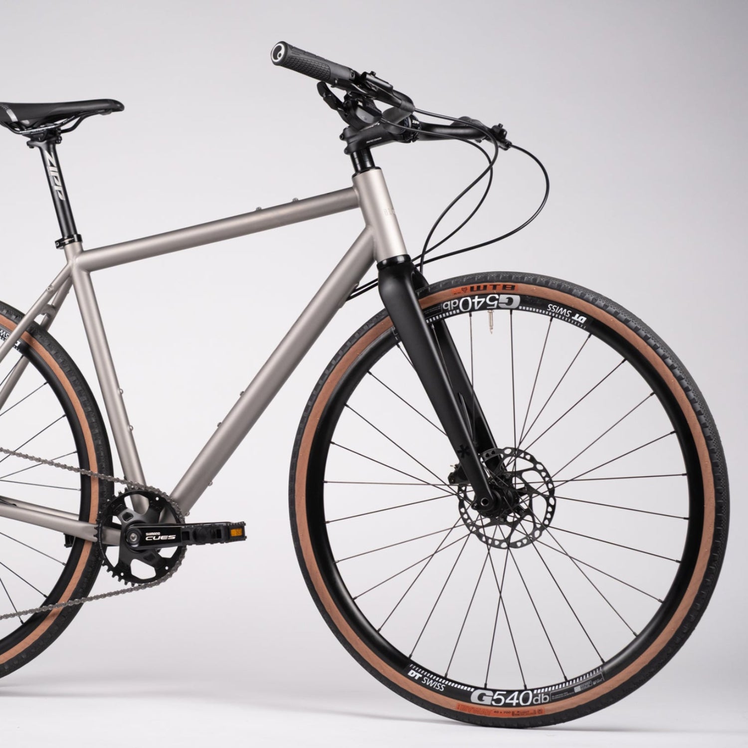 Silver bicycle with black components on a white background