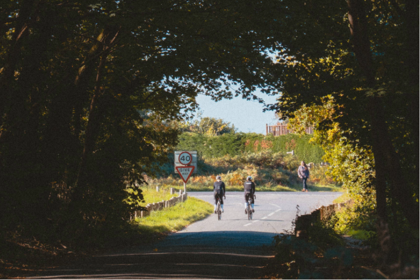 Two cyclist riding off in to the distance