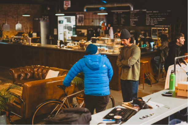 Two people talking about bicycles
